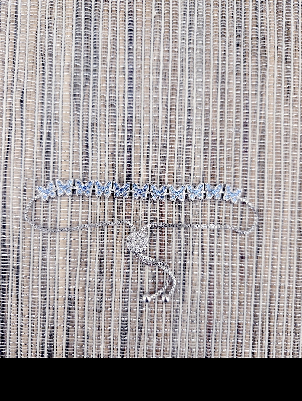 Silver Tone Bracelet with Blue Crystal Butterflies